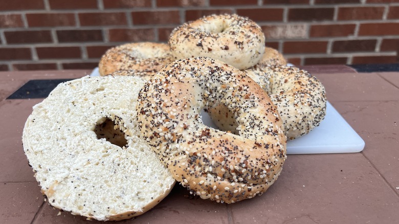 Sliced everything bagel with more in background