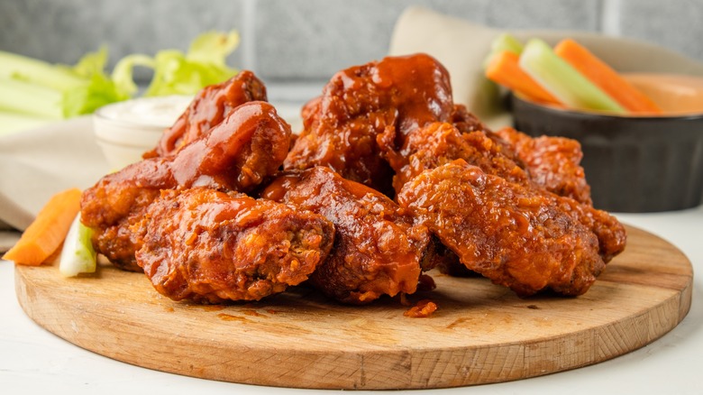 Hot wings on wooden board