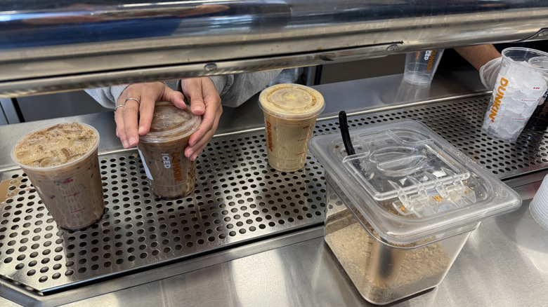 Dunkin iced drinks being made at the on tap counter.