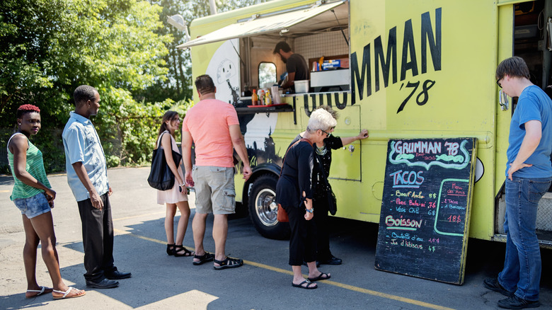 people in food truck line