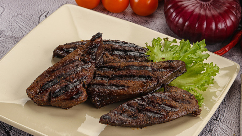 Grilled beef liver pieces on plate