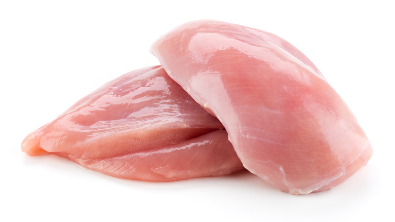 two raw chicken breasts