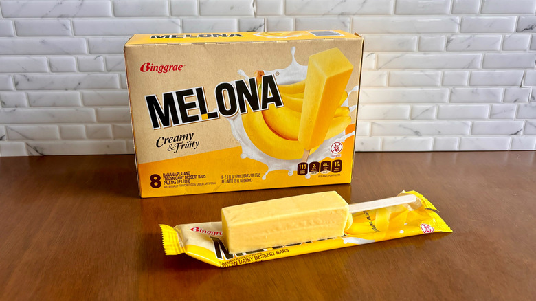 Melona banana flavor box with Melona popsicle unwrapped