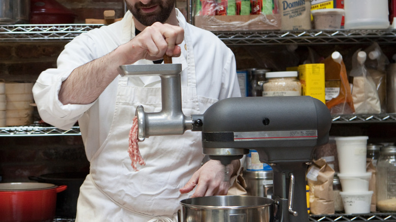 Man grinding meat