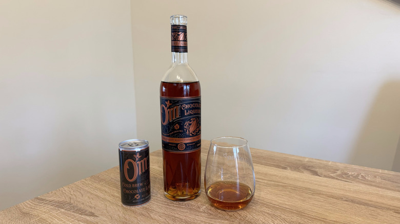 Bottle and can of Om chocolate liqueur