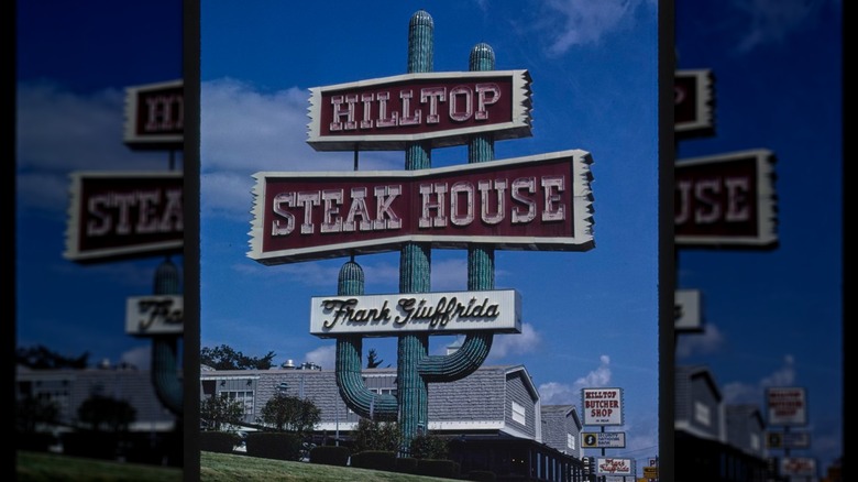 Cactus sign in front of Hilltop Steak House