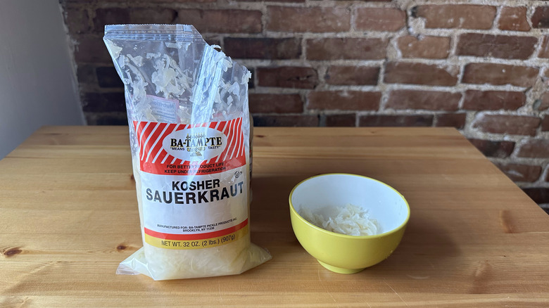 Ba-Tampte Kosher Sauerkraut on wooden table and in bowl