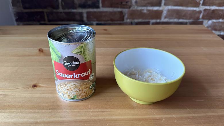 Signature Select Sauerkraut on wooden table and in bowl