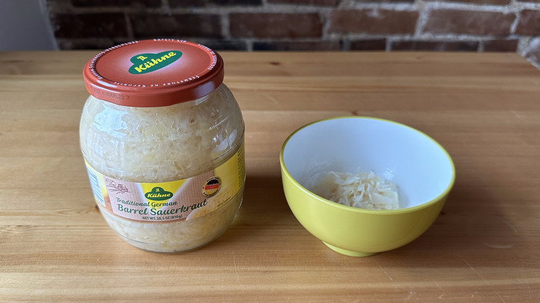 Kühne Traditional German Barrel Sauerkraut on wooden table and in bowl