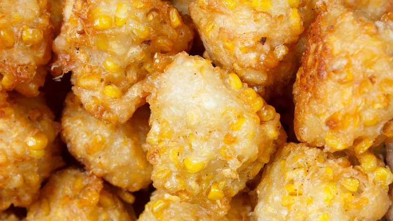 fried corn fritters with pieces of visible corn