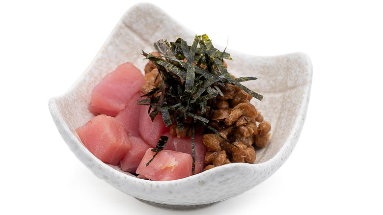 White asymmetrical bowl with maguro natto on white background