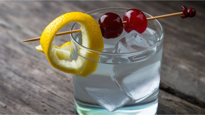 Gin and tonic with skewered garnish on top