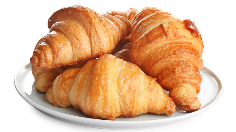 Croissants on white table