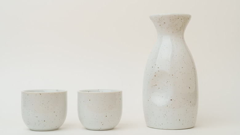 Vessels containing sake in a row