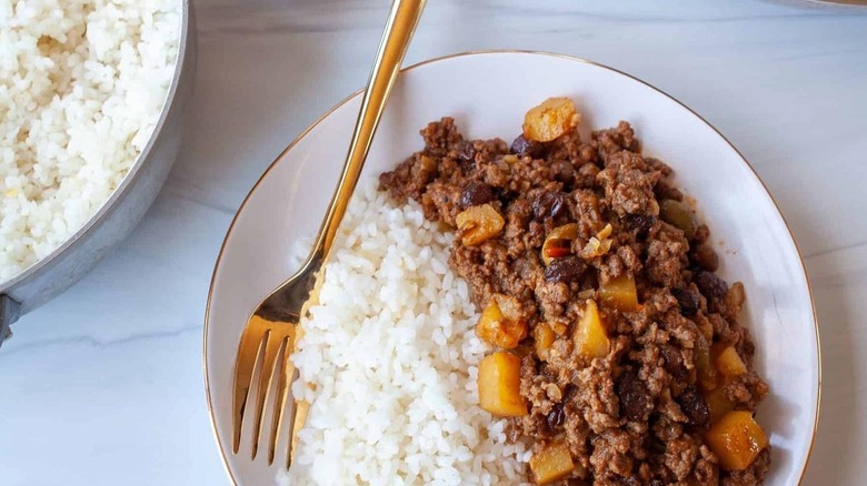 picadillo with gold fork and rice