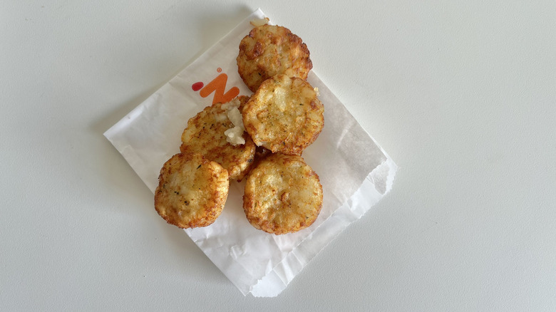 Dunkin' hash browns on paper wrapper