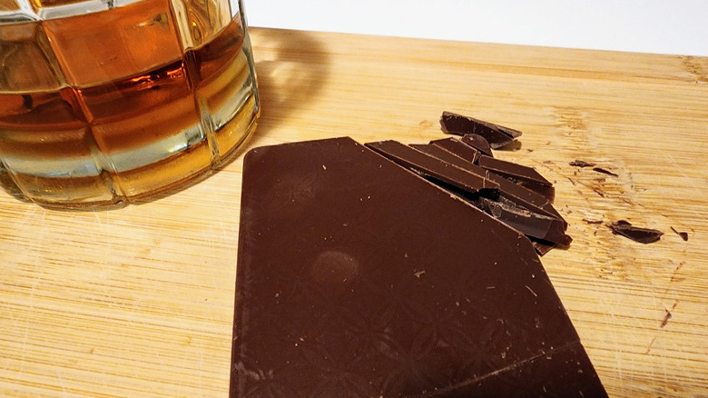 chocolate bar and whiskey glass