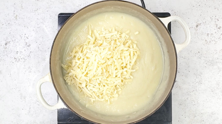 Adding cheese to soup