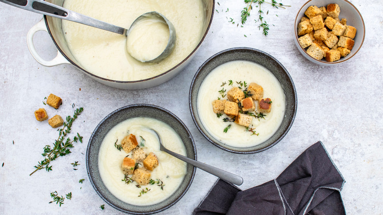 Cheesy Cauliflower Cheddar Soup in bowls