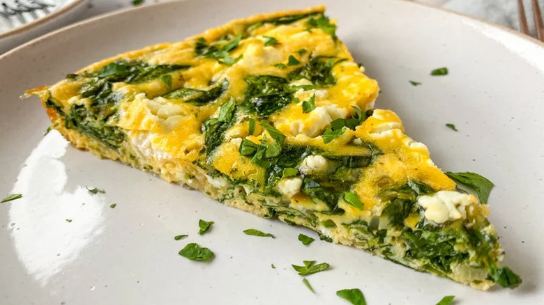 Slice of spinach frittata