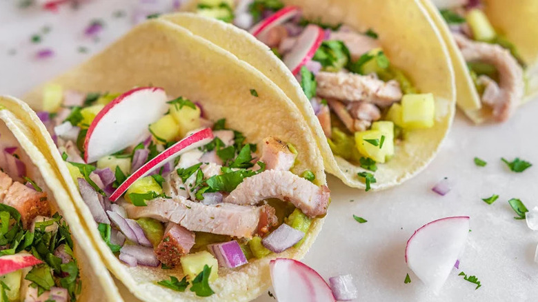 Pork tacos in corn tortillas