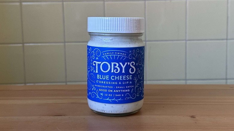 Toby's blue cheese dressing on a wood table