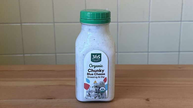 365 blue cheese dressing bottle on a wood table