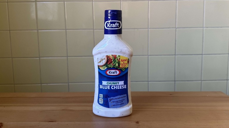 Kraft blue cheese dressing on a wood table