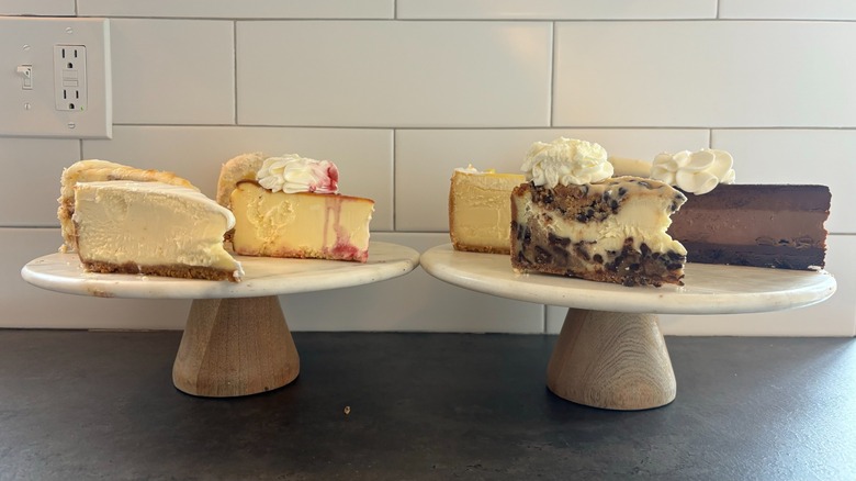 cheesecakes on marble platters on counter