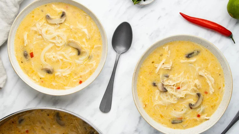 Bowls of Thai chicken noodle soup