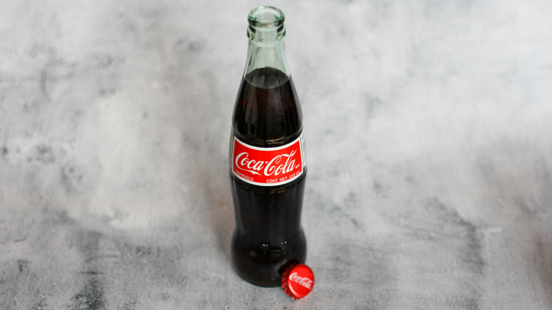 Mexican coke bottle on a gray background