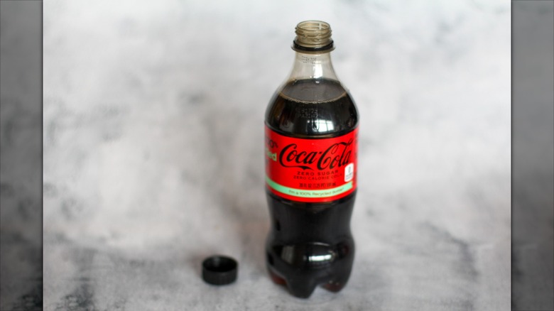 Coke Zero bottle on a gray background