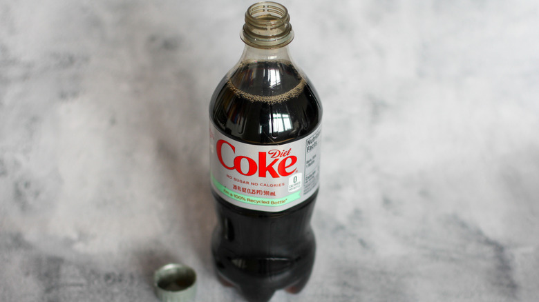 Diet Coke bottle on a gray background