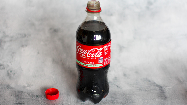 Coca-Cola bottle on a gray background