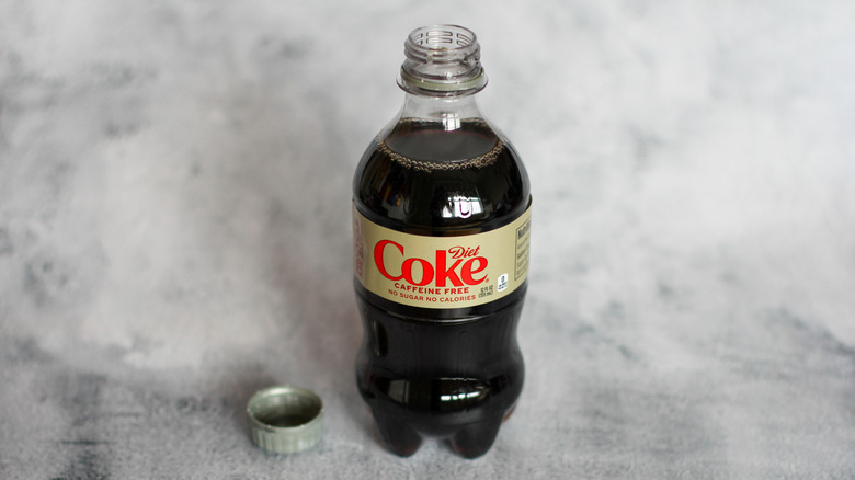 Caffeine-free Diet Coke bottle on a gray surface