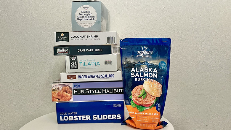 Costco frozen seafood boxes are displayed on a table.