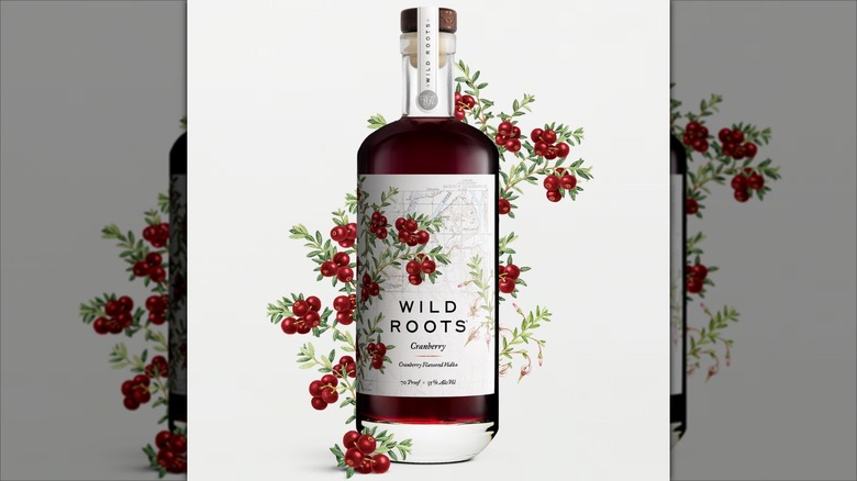 Bottle of Wild Roots cranberry infused vodka with illustrations of cranberries growing.