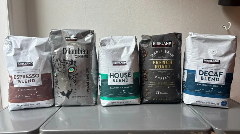 bags of Kirkland Signature coffee flavors lined up on table