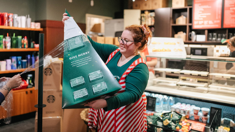 Women decorating Starbucks for holidays