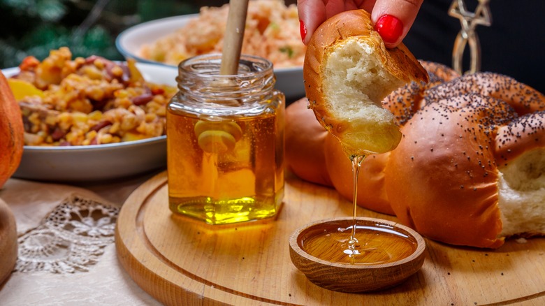 Challah dripping with golden honey