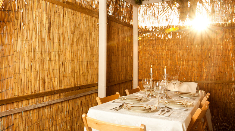 Sukkah with table setting inside 