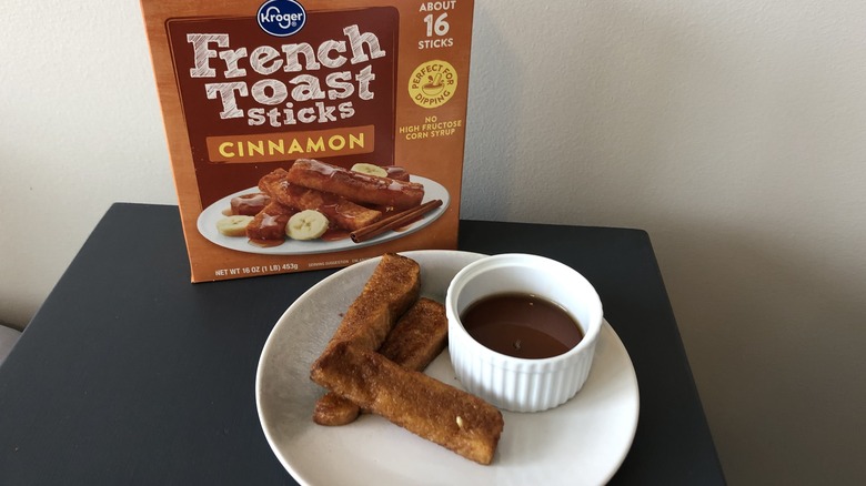 Plate of Kroger French toast sticks and syrup.