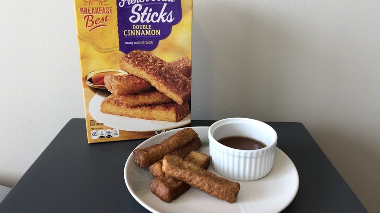 Plate of Aldi Breakfast Best French toast sticks and syrup.