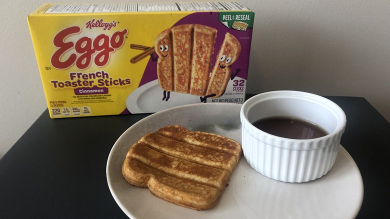 Plate of Eggo cinnamon French toast sticks and syrup.