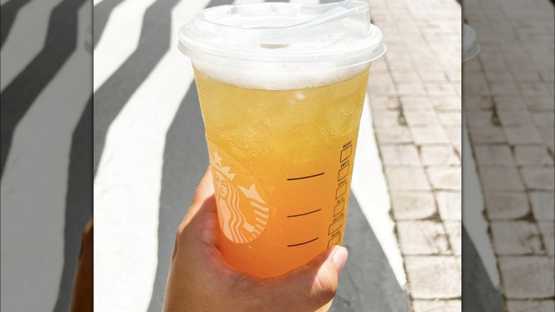 Starbucks lemonade in hand