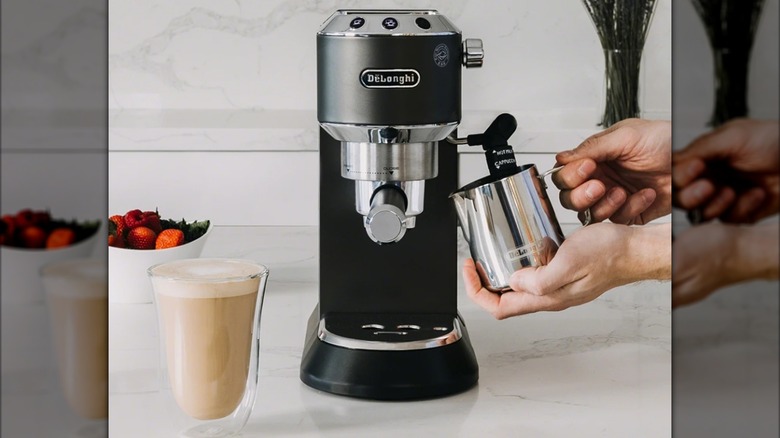 A De'Longhi Dedica Deluxe Manual Pump Espresso Machine on a counter