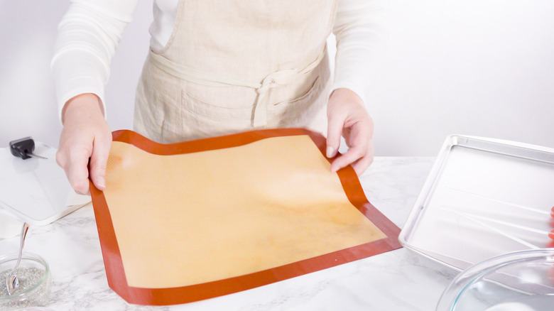 Chef holding silicone baking mat