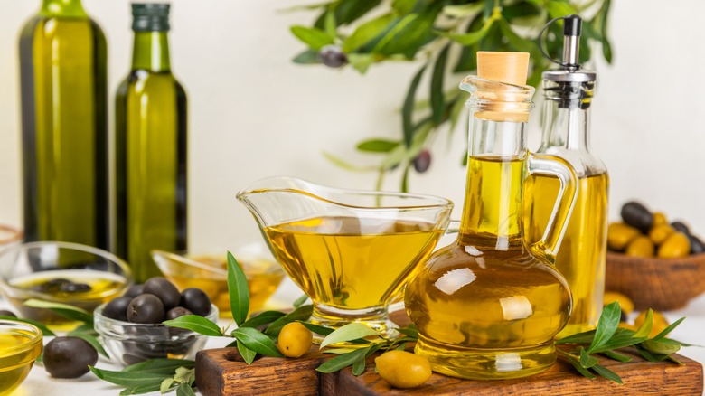 olive oil bottles and olives