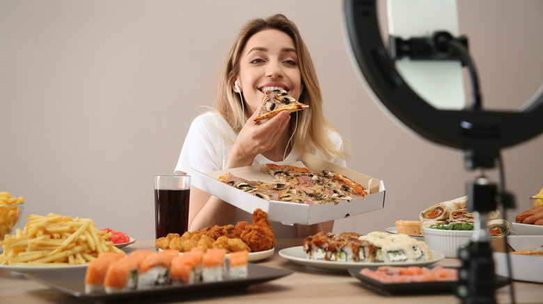 Mukbang influencer eating pizza