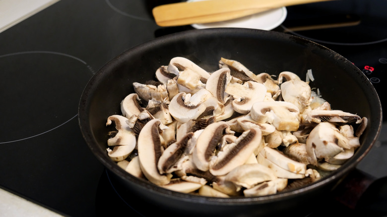 sliced mushrooms in pan